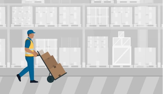 Warehouse associate transporting goods with a manual hand cart.