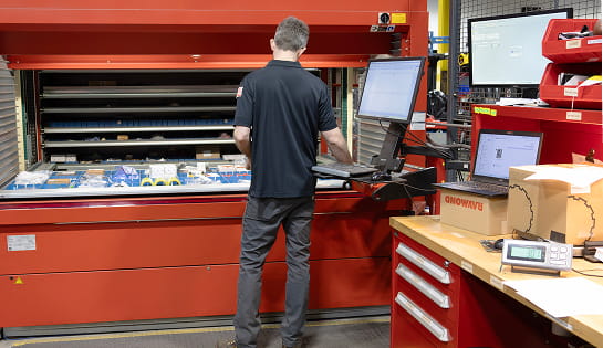 RSC parts associate retrieving material handling components from an AS/RS for customer order fulfillment.