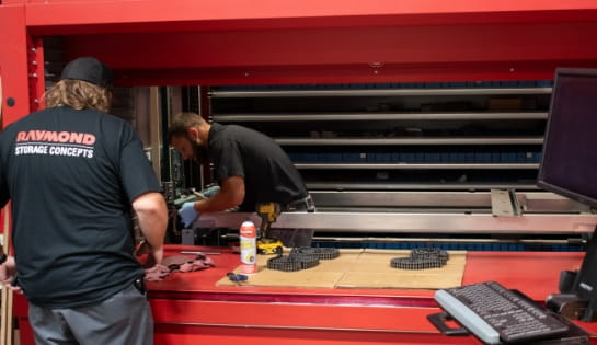 RSC technicians installing a new automated storage and retrieval system in a warehouse facility.