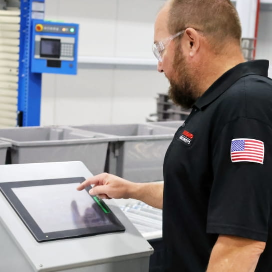 RSC technician reviewing system diagnostics on a conveyor control screen.
