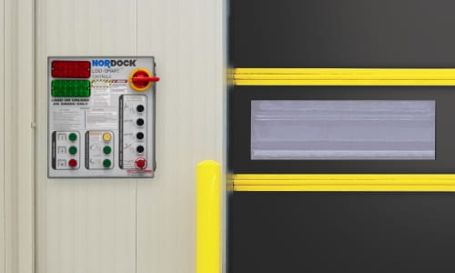 Warehouse loading dock wall featuring an advanced dock control panel.