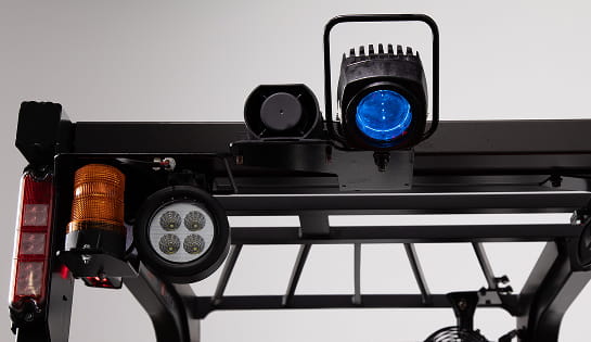 Close up of a forklift overhead guard showcasing blue safety light and warning light options