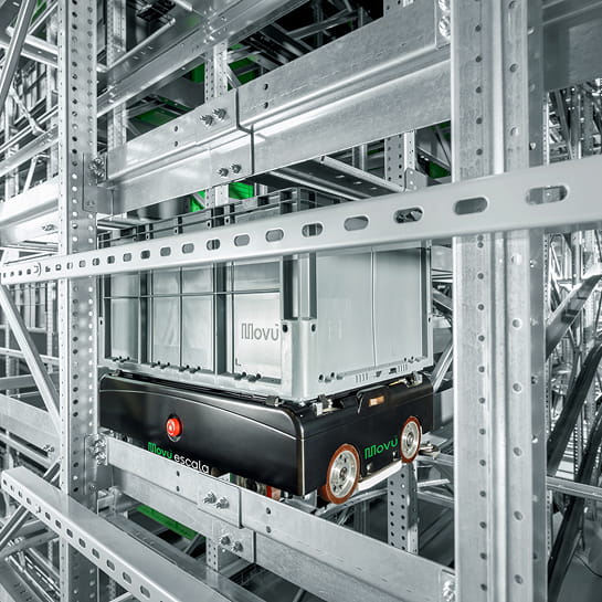 Close-up of a Movu shuttle cart carrying a box inside a high-density pallet shuttle racking system