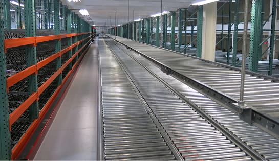 Roller conveyor integrated within a multi-level pick module at a Central Ohio retail distribution facility
