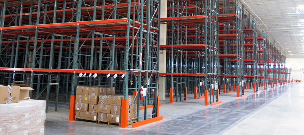Multiple aisles of newly installed pallet rack in a Central Ohio retail warehouse