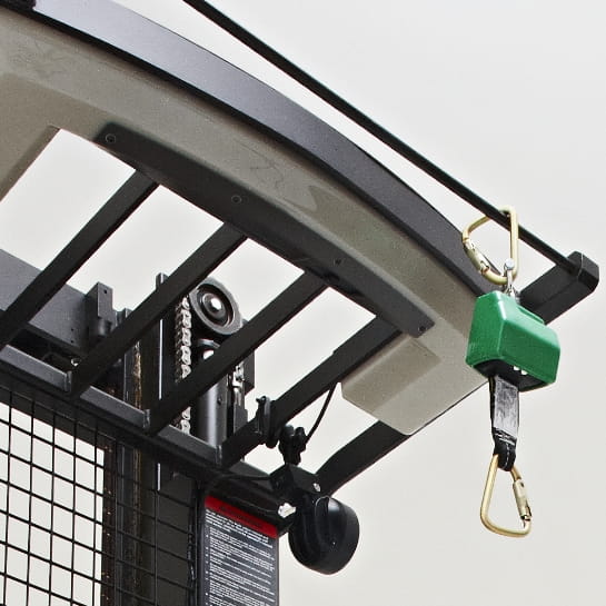 Close-up of a safety harness tether hanging from the overhead guard of a Raymond orderpicker